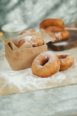 doughnuts in powdered sugar