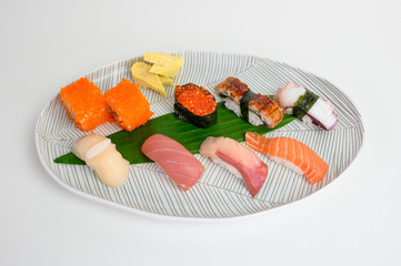 Japanese nigiri sushi set of traditional food on white plate