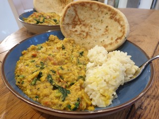 Cooked Lentils and rice in plate with naan