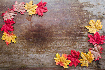 Autumn leaves on wooden background with copy space. Wallpaper for September thanksgiving.