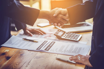 man writing on paper