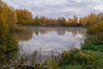 Fototapeta na wymiar autumn landscape with lake and forest