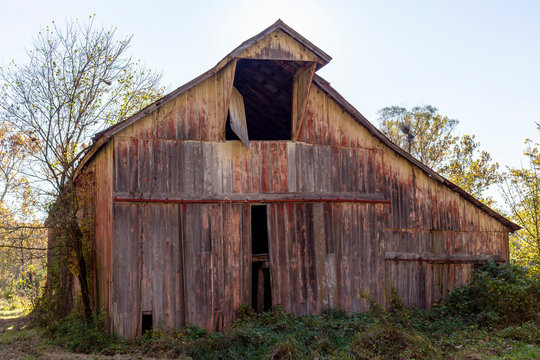 old run down barn with faded weathered paint
