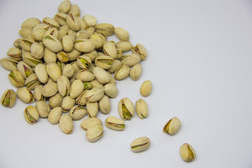 slide of pistachios on a white background. isolate