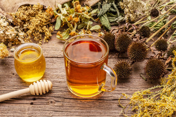 Tea with honey. Herbal harvest collection and bouquets of wild herbs. Alternative medicine. Natural pharmacy, self-care concept