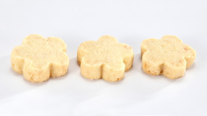 A cookie is a baked food that is typically small, flat and sweet. It usually contains flour, sugar and some type of oil or fat. It may include other ingredients such as raisins, oats, chocolate.