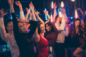 Profile side photo of cheerful buddies company corporate group people feel crazy on graduation university event party hard have fun dance on discotheque raise hands - obrazy, fototapety, plakaty