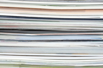 Background from stacked magazines, brochures, notebooks, catalogs