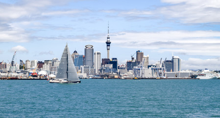 Downtown Auckland and Colorful Sailboat on Water - Auckland, New Zealand