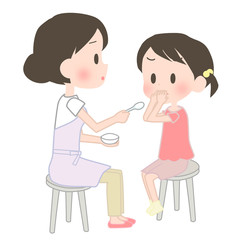 子供に薬を飲ませる母親
