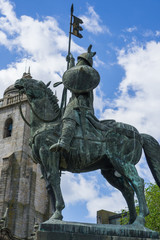 Statue of Vimara Peres ( the first ruler of the County of Portugal) in front of the Porto Cathedral in Porto city , Portugal .