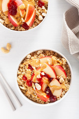 apple peanut butter quinoa bowl with jam and cashew for healthy breakfast