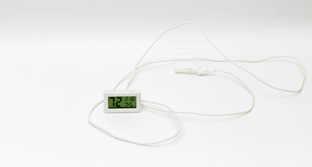 Internal electronic LCD digital clock with temperature and humidity sensor, display on a white background