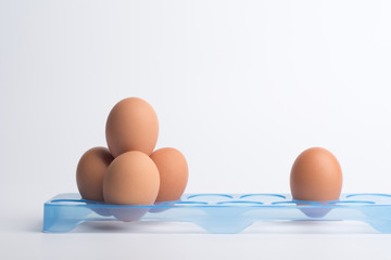 Fresh eggs on a white background.