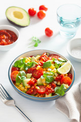 healthy vegan avocado sweetcorn tomato salad