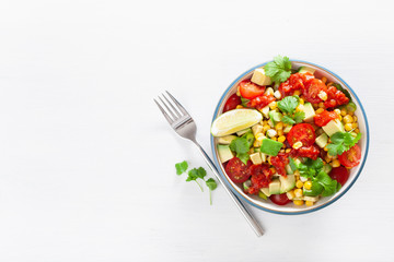 healthy vegan avocado sweetcorn tomato salad