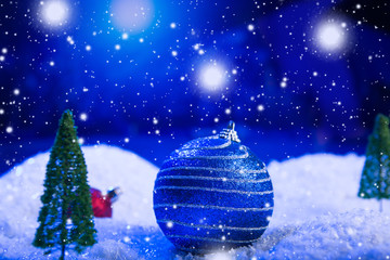 Fototapeta na wymiar Christmas background with Christmas balls on snow over fir-tree, night sky and moon. Shallow depth of field. Christmas background. Fairy tale. Macro. Artificial magic dreamy world.