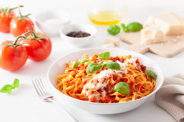 tagliatelle pasta with tomato sauce parmesan basil