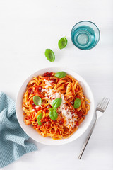 tagliatelle pasta with tomato sauce parmesan basil