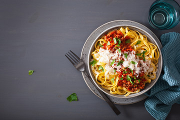 tagliatelle bolognese with herbs and parmesan, italian pasta