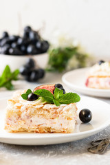Pavlova on a biscuit with a gentle curd cream and fruit.