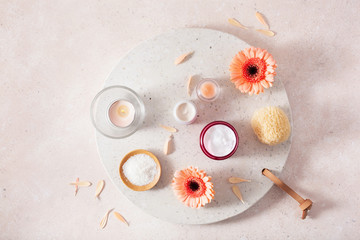 skincare products and daisy flowers. natural cosmetics for home spa treatment