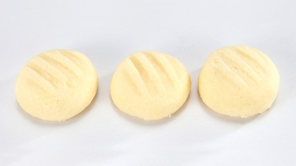 A cookie is a baked food that is typically small, flat and sweet. It usually contains flour, sugar and some type of oil or fat. It may include other ingredients such as raisins, oats, chocolate.