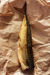 Delicious golden fish on the table close up