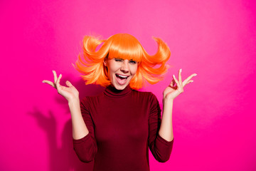 Photo of playful lady in bright wig throwing hair up air rejoicing about weekend time wear red turtleneck isolated pink color background
