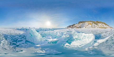 Blue hummocks of winter Lake Baikal in the afternoon under a blue sky. Spherical panorama 360vr