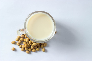 Obraz na płótnie Canvas Isolate soy milk and beans on white background.The best meal for vegan. In the vegetarian festival are coming soy beans were the best food for everyone.