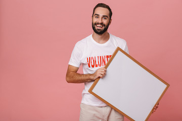 Happy young man volunteer standing