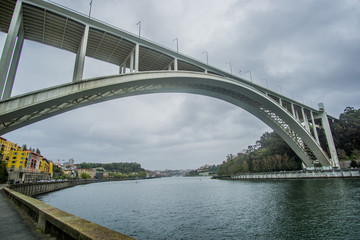 Ponte da Arrábida a landmark arch bridge over the Douro river In Porto , Portugal very close to where its connecting to the Atlantic ocean.  