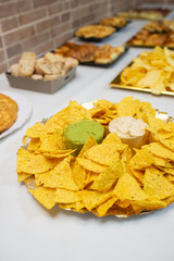 Table of appetizers with mexican nachos