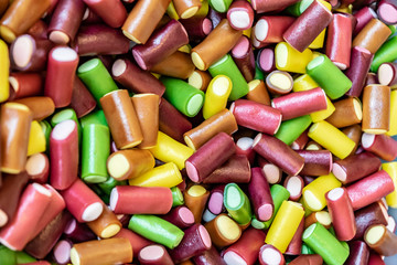 Bright colorful candies background. Mix of colorful sweet chews. 