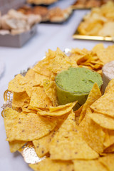 Table of appetizers with mexican nachos