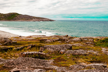 Beautiful summer day North landscape waves, foam and spray Barents sea Teriberka view.