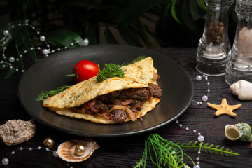 Chinese onion tortilla with beef and onions in a black plate