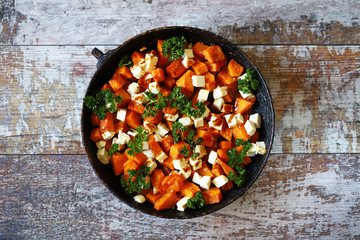 Salad with baked pumpkin and feta. Thanksgiving salad. Autumn keto salad. Keto diet. Selective focus. Macro.