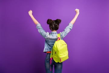 Back rear spine photo of delighted high schoolgirl pass exam become best scholarship student in campus wear casual style stylish trendy clothes isolated over violet color background