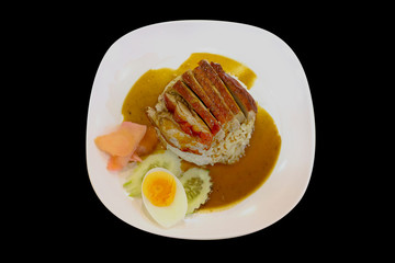 Roasted duck topping on thai rice, Roasted bbq duck with gravy sauce, focus selective.