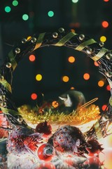 New Year decorations - pomegranate, christmas wreath and bird.