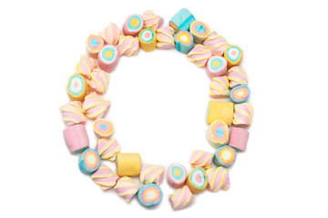 Frame of multi-colored sweets on a white background, isolate. Holiday Marshmallows