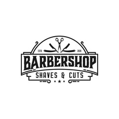 Fototapeta premium Barbershop logo with a complex design of elegant vintage details with professional scissors and razor elements, for your business and professional barbershop label with quality services.