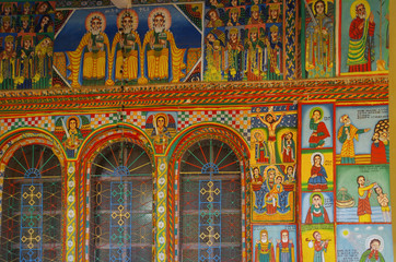 Fototapeta na wymiar Exterior paintings. Christian murals on the walls. Illustrations of New Testament. Enda Iyesus Church. Ethiopia, Tigray Region, Maekelay Zone, Axum (Aksum)