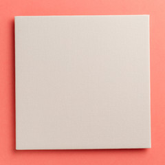 Creative layout made of paper blank on pastel on coral background. Top view. Flat lay. Copy space. Colorful background. Minimal creative concept. Living coral - trendy color of the year 2019
