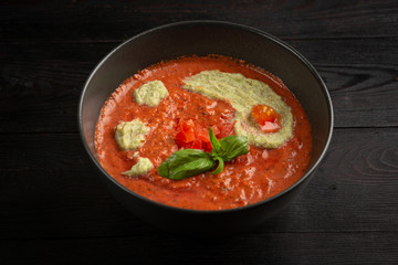 tomato cream soup in a black plate