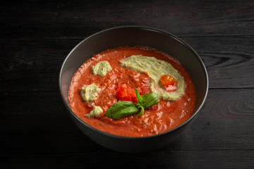 tomato cream soup in a black plate
