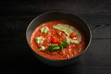 tomato cream soup in a black plate