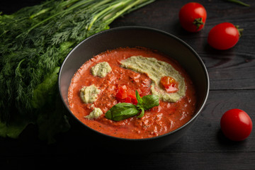 tomato cream soup in a black plate